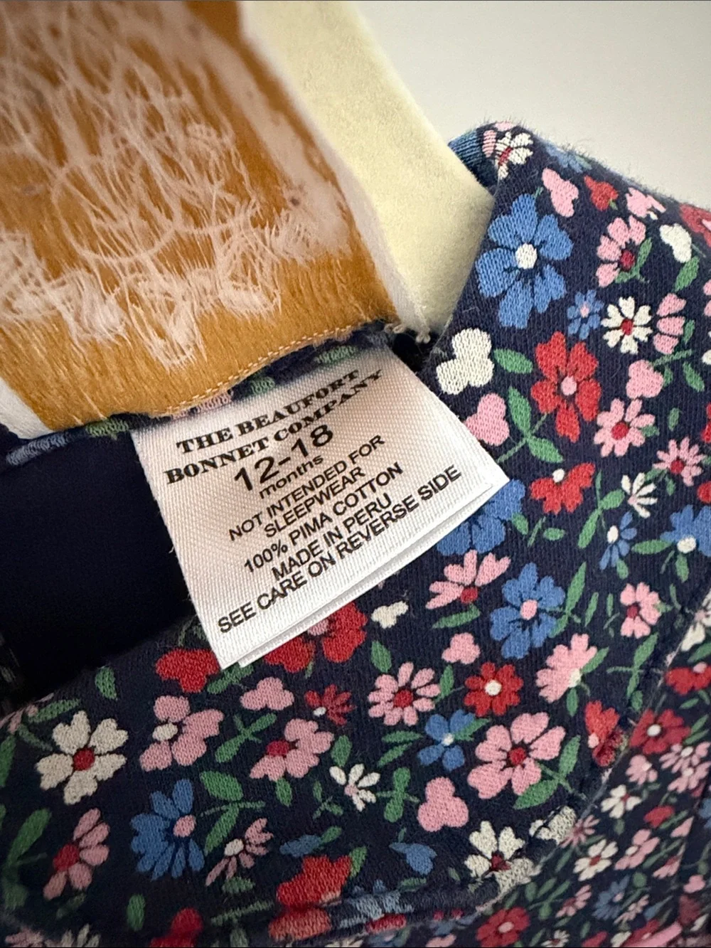 The Beaufort Bonnet Company Fairfax Floral Navy One-Piece with Pink Trim